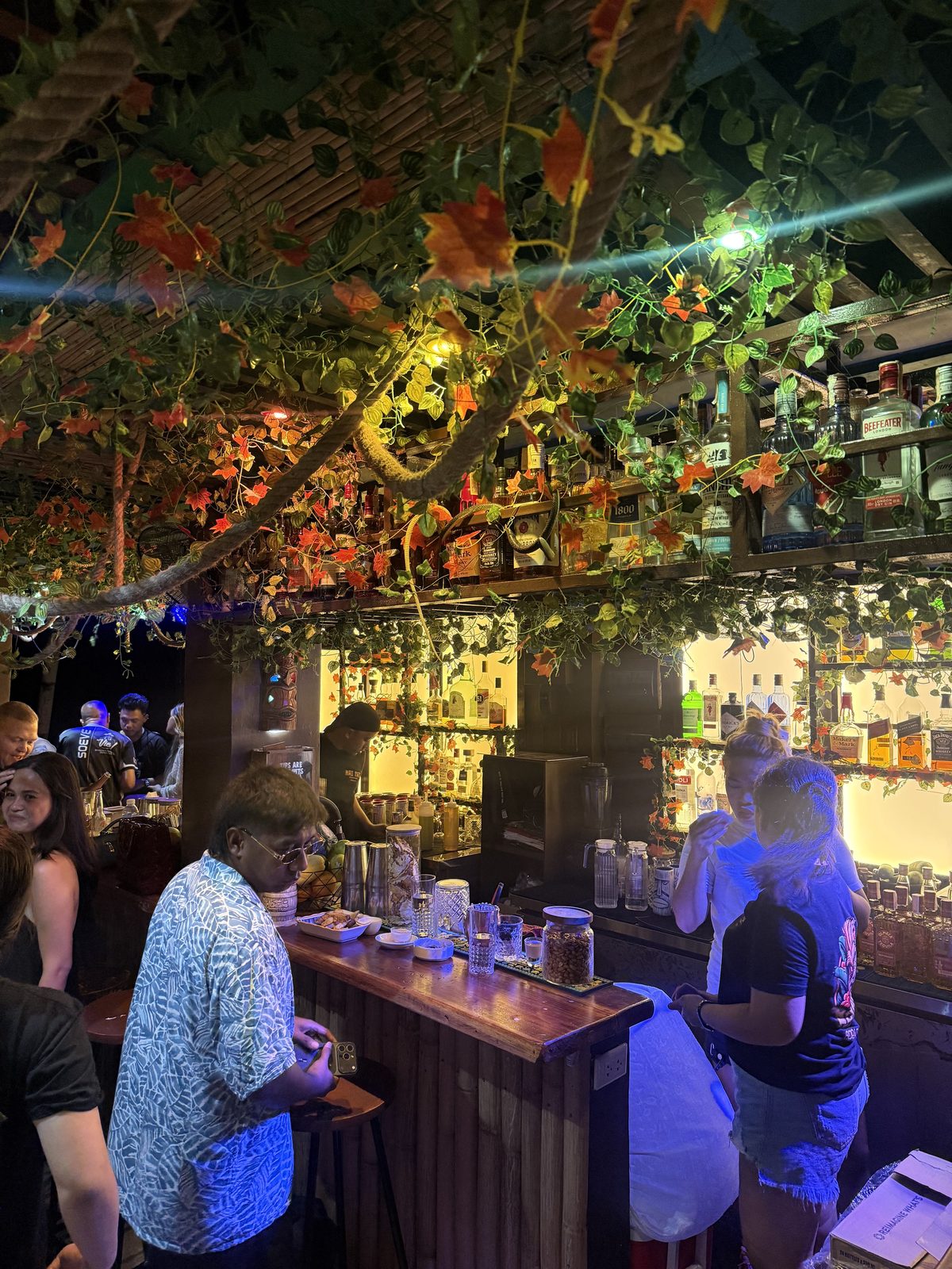 Busy beachfront bar counter at night at Mai Tai Beach Bar Boracay