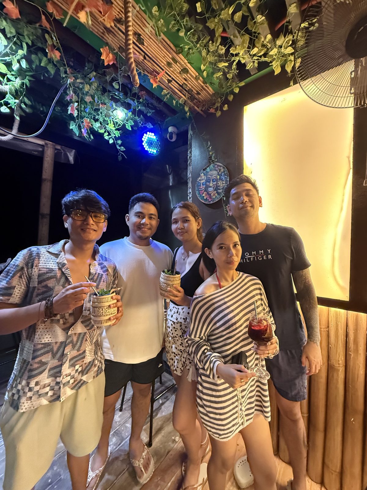 Friends with cocktails on a night out at Mai Tai Beach Bar Boracay